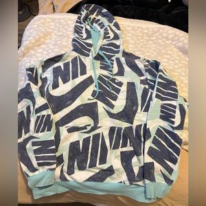 Nike Sweatshirt. Not sure on size fits like Medium. Blue color.